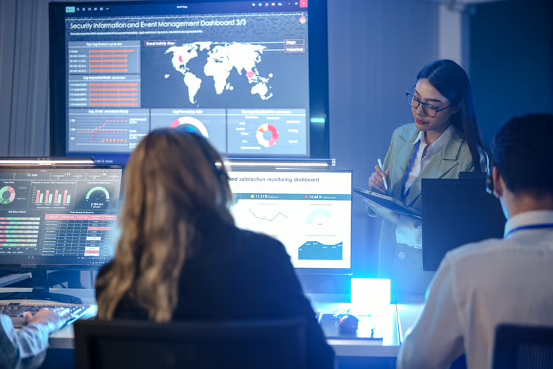 Technology team monitoring multiple screens during an incident response and crisis management operation.
